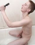 Horny blonde twink Foxxx washes himself and masturbates in