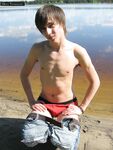 Gay beauty Mike strips by the river and plays with his hard
