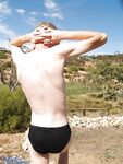 Blond gay Ash G doffs his black panties and jerks off his