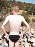 Blond gay Ash G doffs his black panties and jerks off his