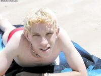 Blond twink Levi doffs his shirt and red undies and