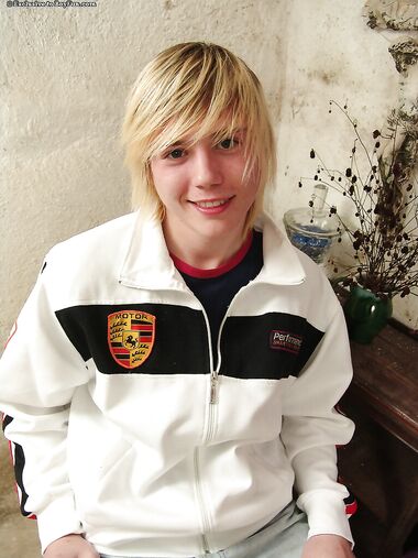 Young blonde twink Phil exposes his small dick and